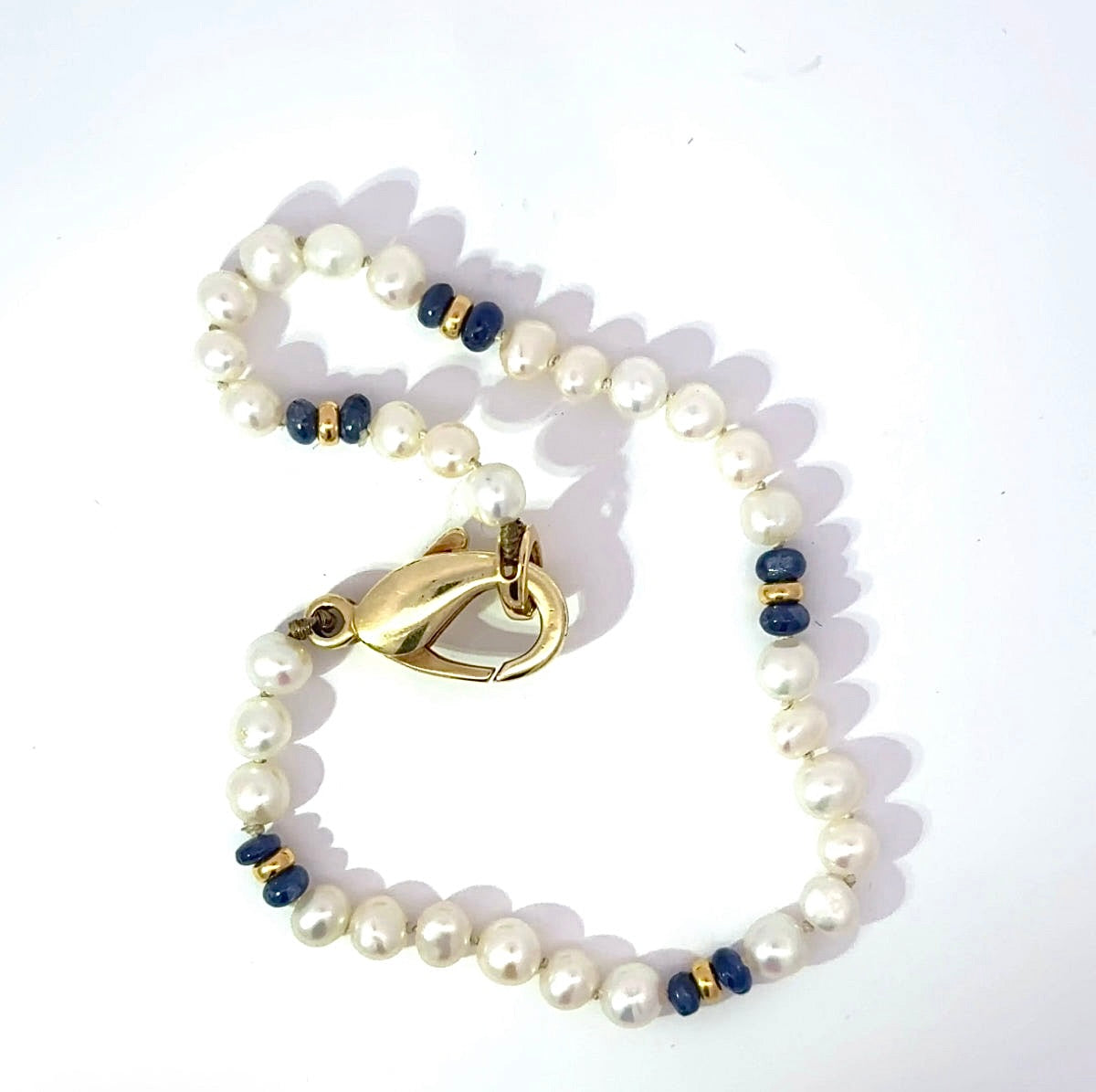 Playful Pearl Bracelet with 14K Yellow Gold and Blue Sapphires