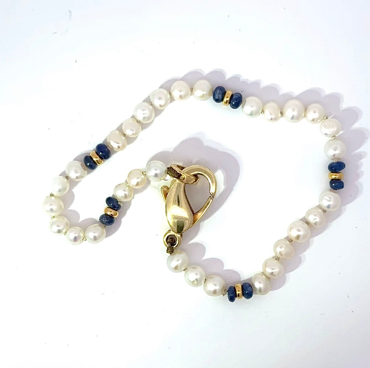 Playful Pearl Bracelet with 14K Yellow Gold and Blue Sapphires