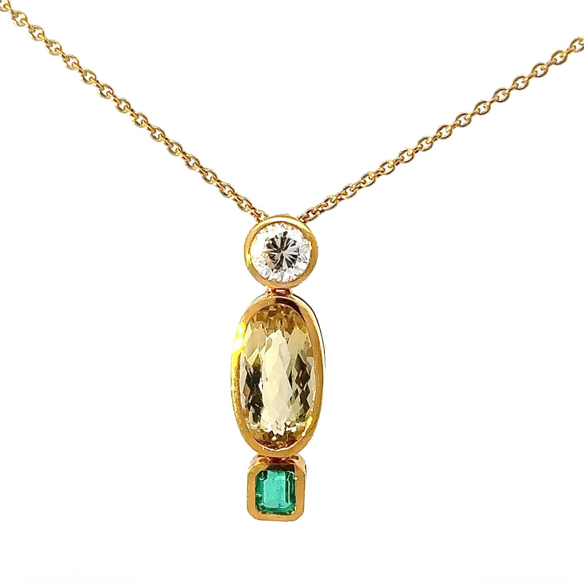 Modern pendant in 18K yellow gold with brilliant-cut diamond, emerald & heliodor