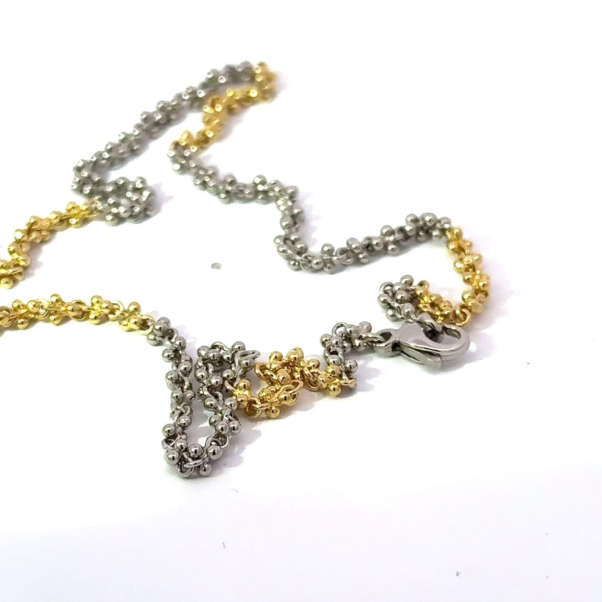 Ausgefallene Halskette in 18 Karat Gelbgold und 950er Platin