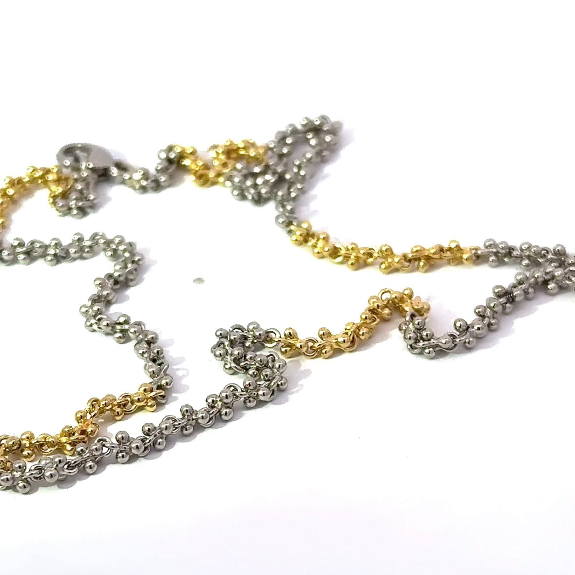 Ausgefallene Halskette in 18 Karat Gelbgold und 950er Platin