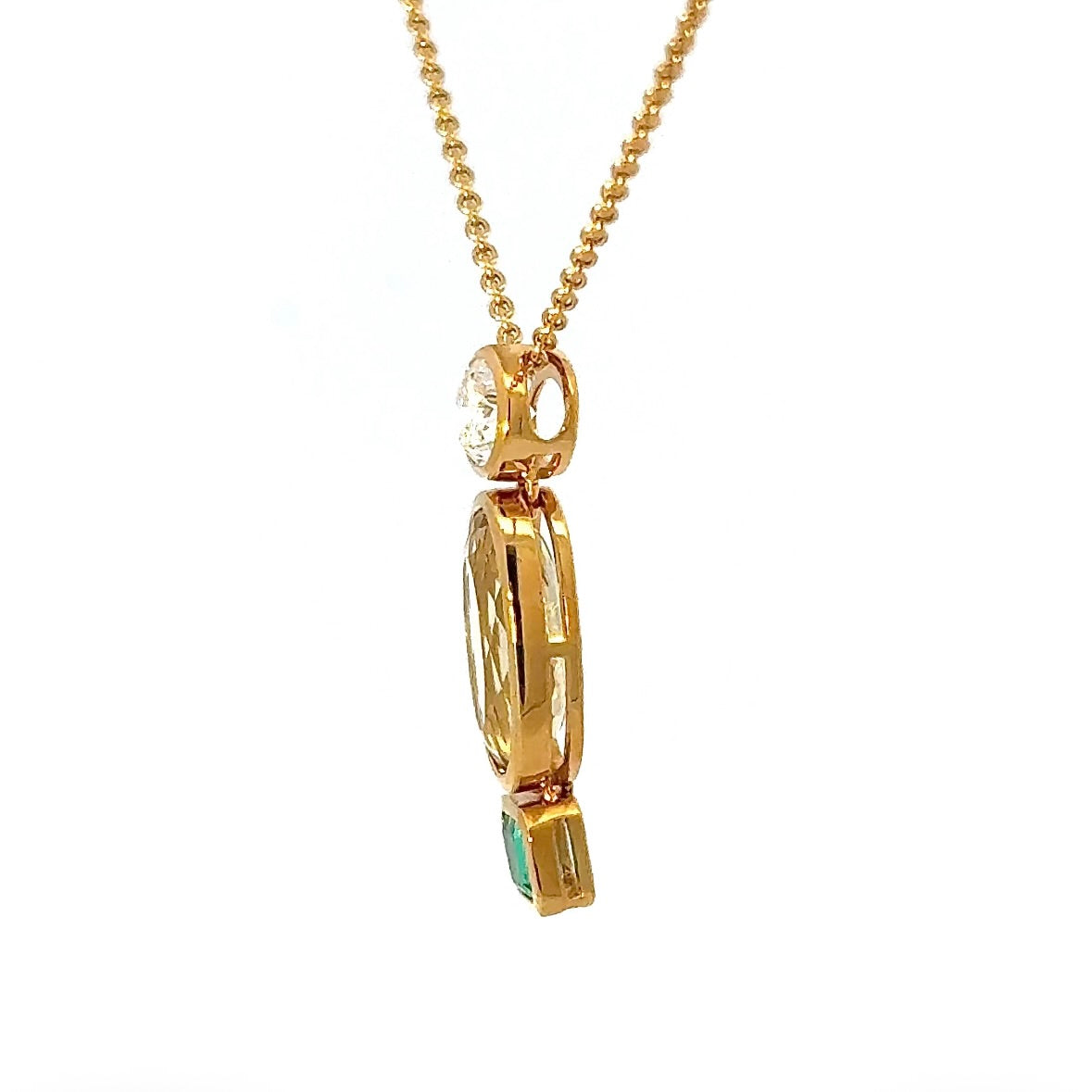 Modern pendant in 18K yellow gold with brilliant-cut diamond, emerald & heliodor