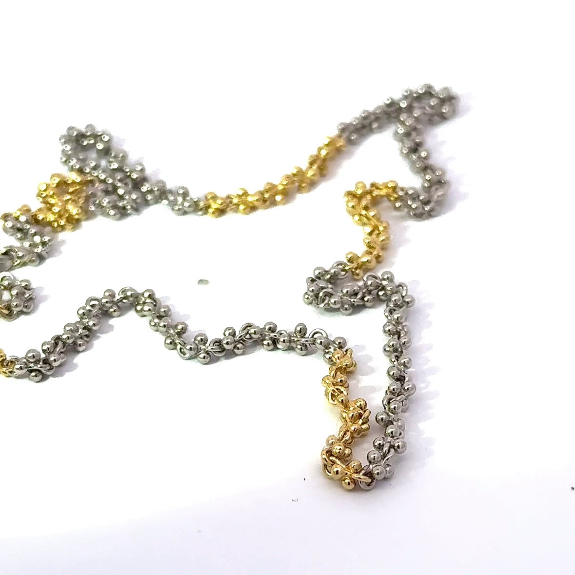 Ausgefallene Halskette in 18 Karat Gelbgold und 950er Platin