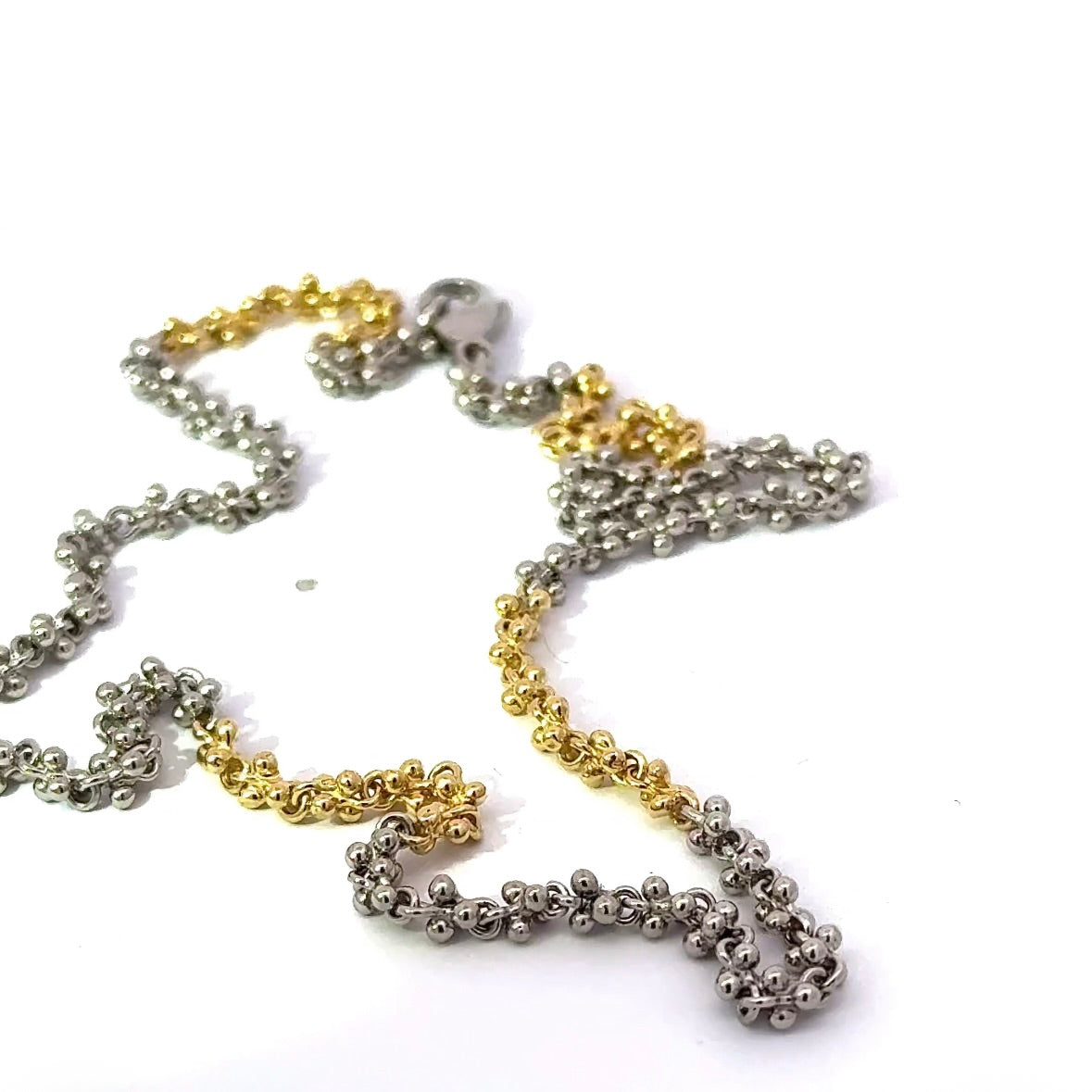 Ausgefallene Halskette in 18 Karat Gelbgold und 950er Platin