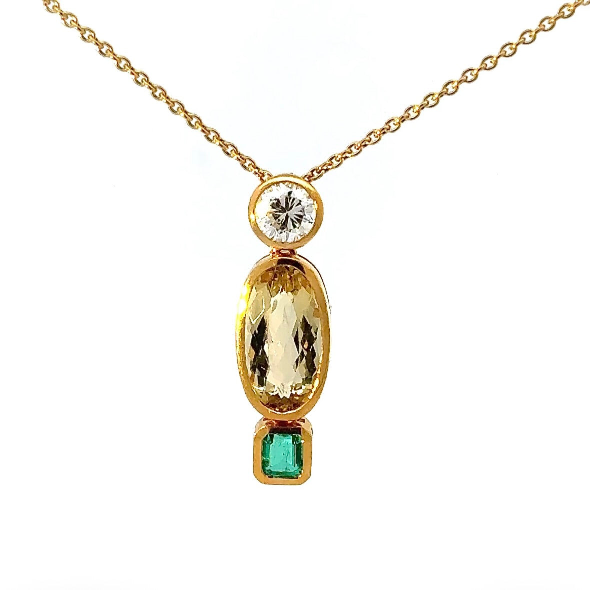 Modern pendant in 18K yellow gold with brilliant-cut diamond, emerald & heliodor