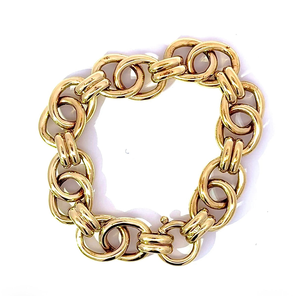 Wide 14 karat yellow gold bracelet with spring ring clasp