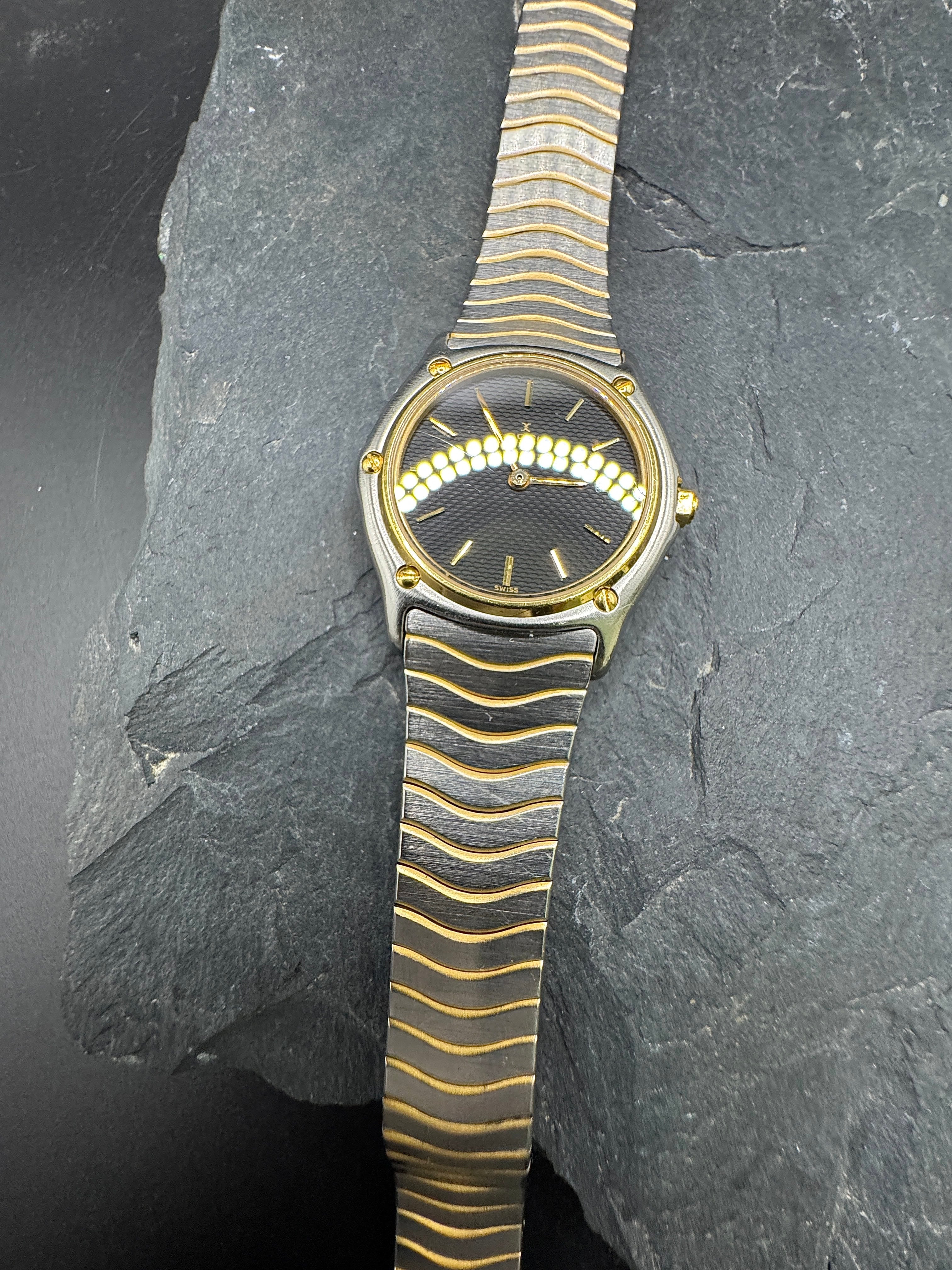 Ebel Sport Classique Damenuhr in Gold/Stahl mit schwarzem Zifferblatt