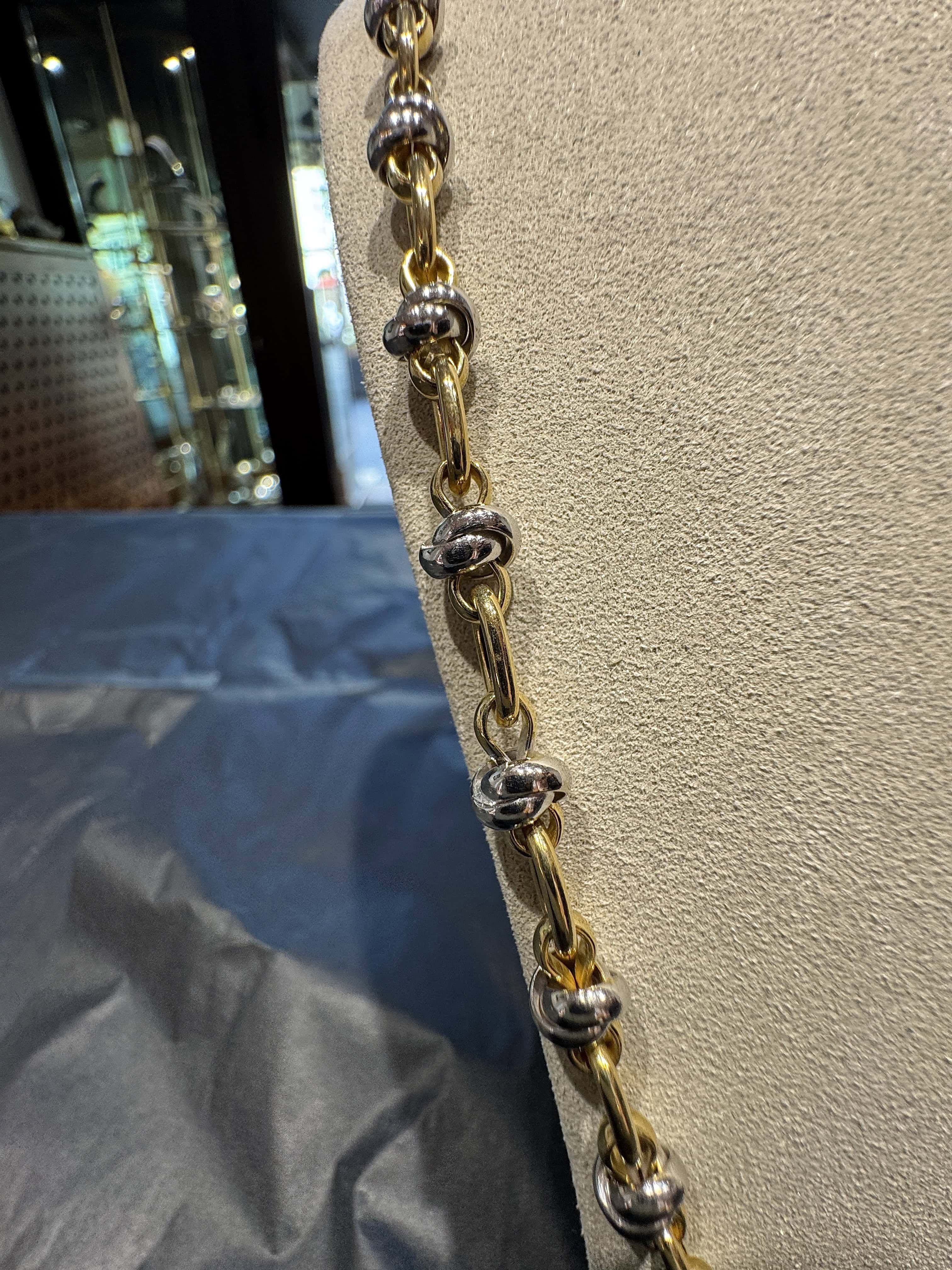 Ausgefallene Halskette in 18 Karat Gelb- und Weißgold mit Armband
