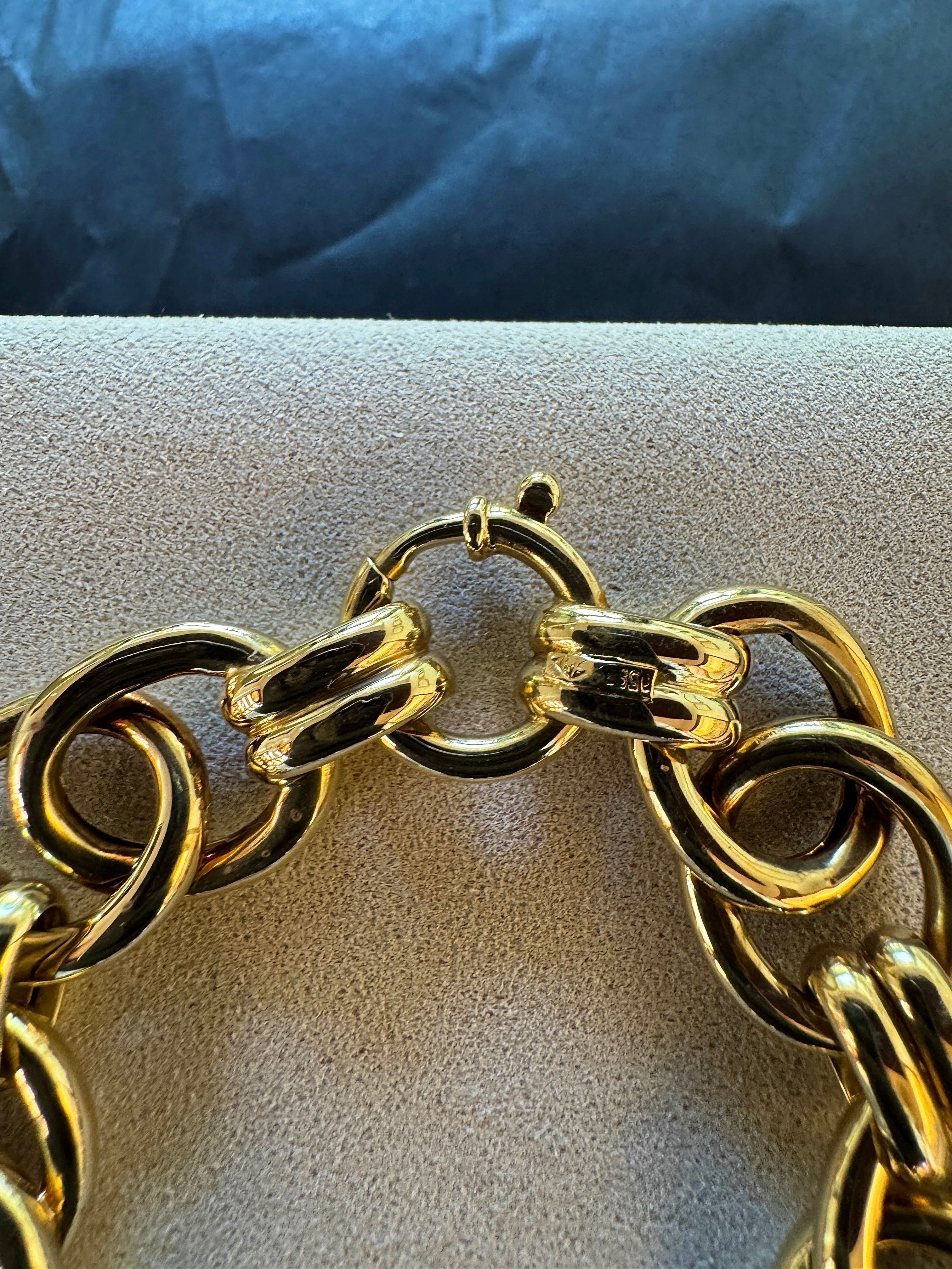 Wide 14 karat yellow gold bracelet with spring ring clasp