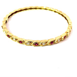 Zeitloser Armreif in 14 Karat Gelbgold mit Rubinen und Brillanten
