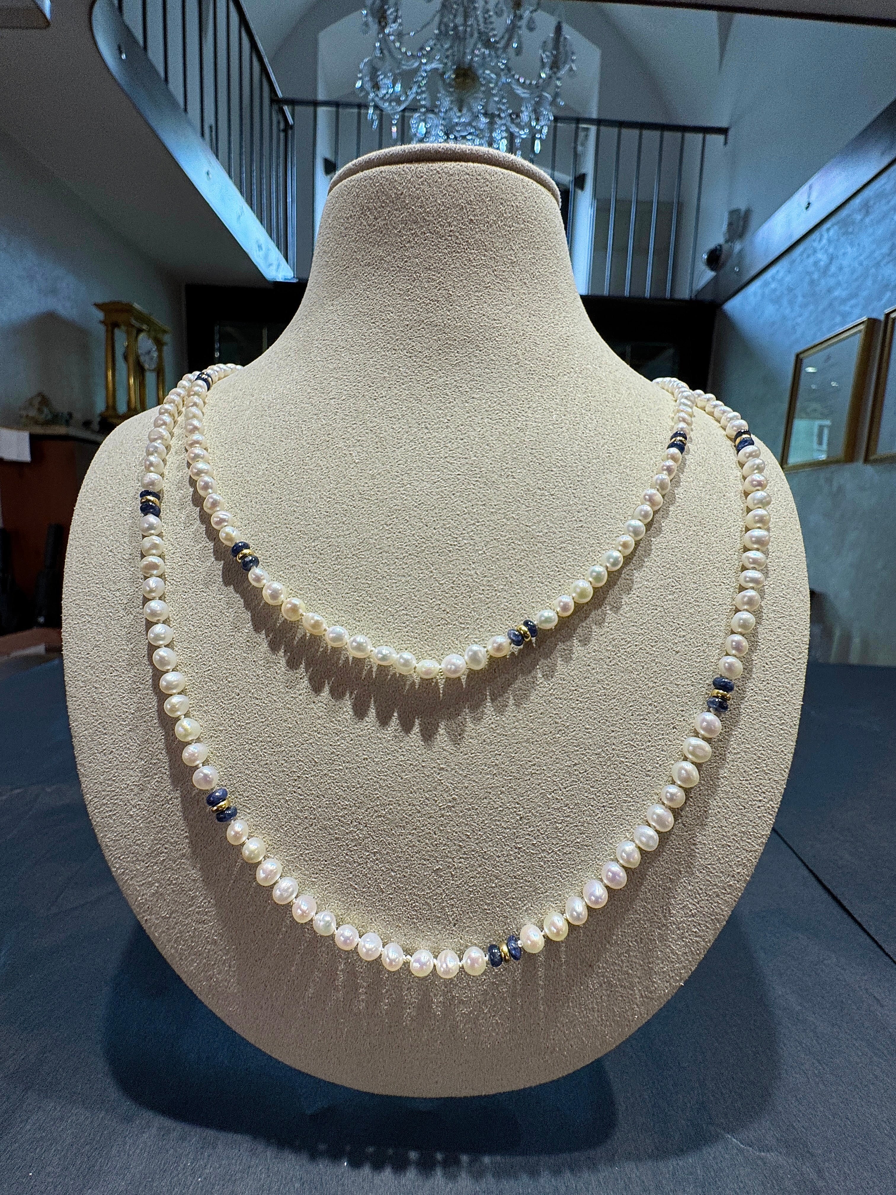 Extravagant pearl necklace with blue sapphires and gold elements