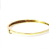 Aufregender Armreif in 14 Karat Gelbgold mit Rubinen und Diamanten