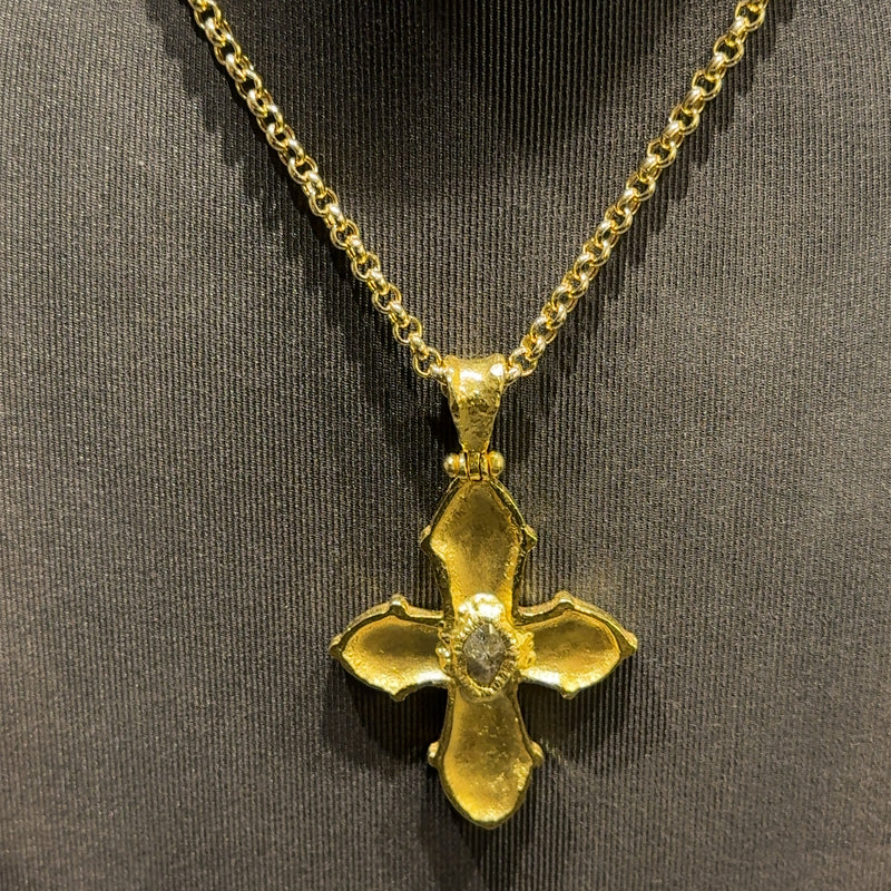 Unverwechselbares Kreuz in 18 Karat Gelbgold mit großen Rohdiamant und Kette