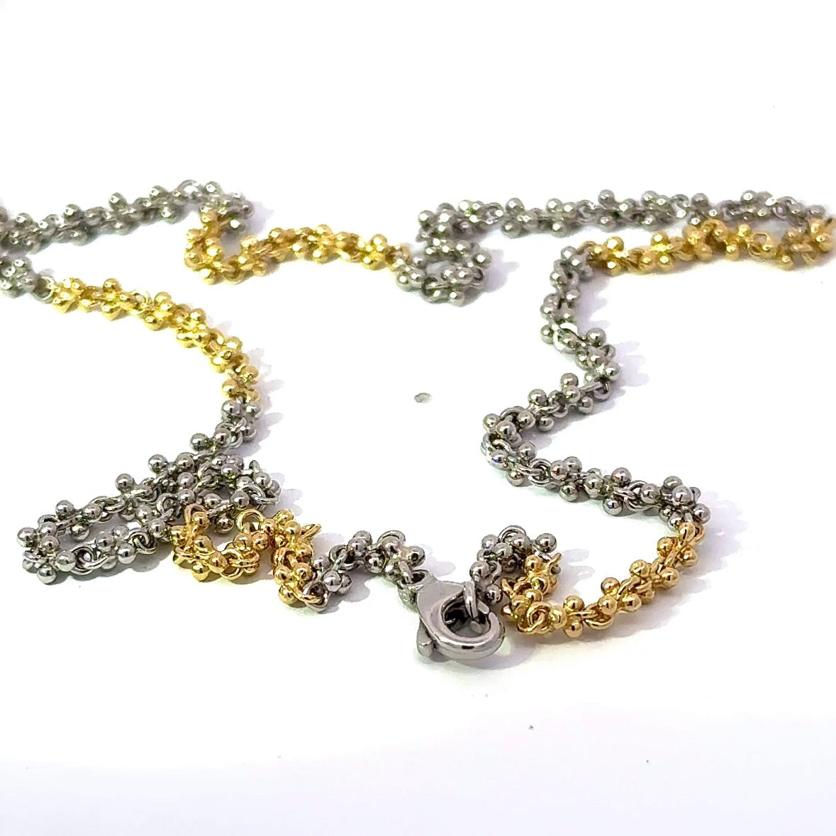 Ausgefallene Halskette in 18 Karat Gelbgold und 950er Platin