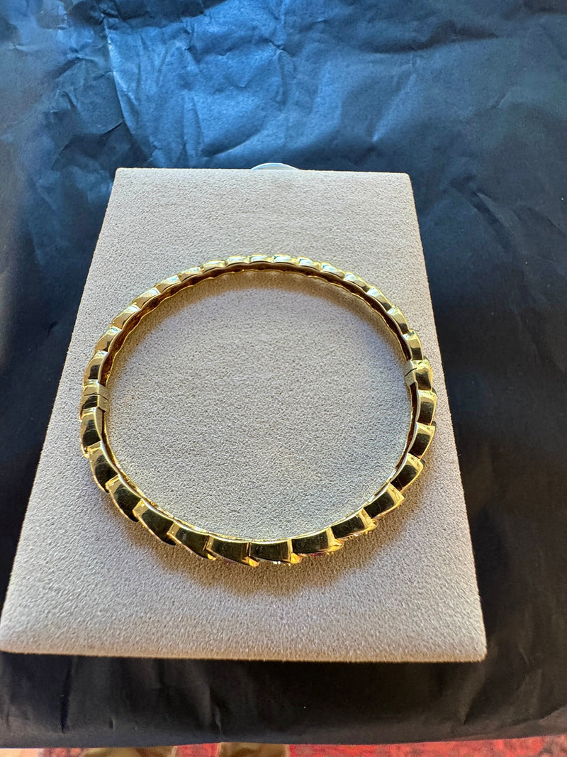 Zeitloser Armreif in 14 Karat Gelbgold mit Rubinen und Brillanten