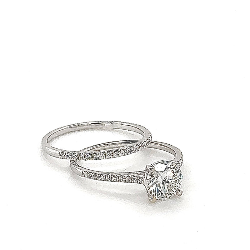 Solitaire ring in 18 carat (750/-.) white gold with one-carat brilliant cut diamond and pre-inserted ring
