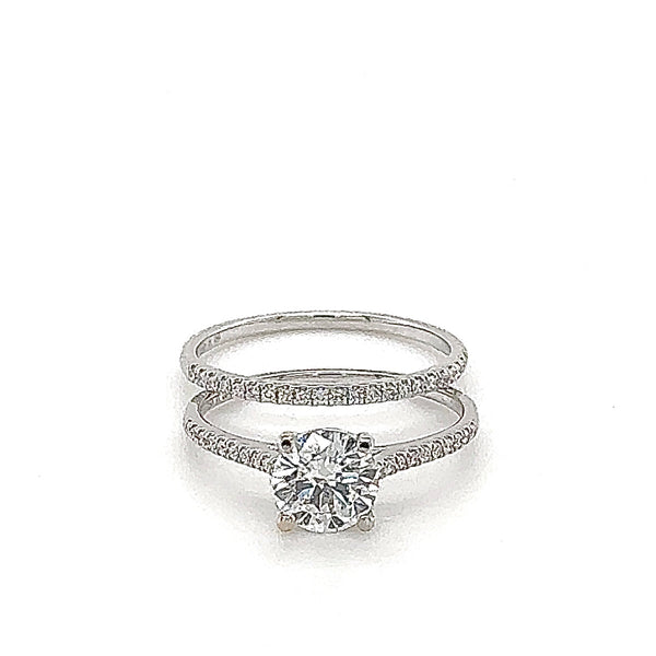 Solitaire ring in 18 carat (750/-.) white gold with one-carat brilliant cut diamond and pre-inserted ring