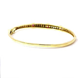 Aufregender Armreif in 14 Karat Gelbgold mit Rubinen und Diamanten