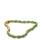 Steinbetontes Armband in 14 Karat Gelbgold mit Smaragden & Brillanten