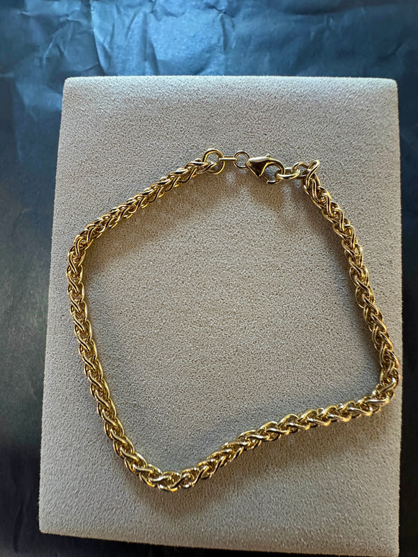 Elegantes Zopf Armband in 14 Karat Gelbgold mit Karabiner