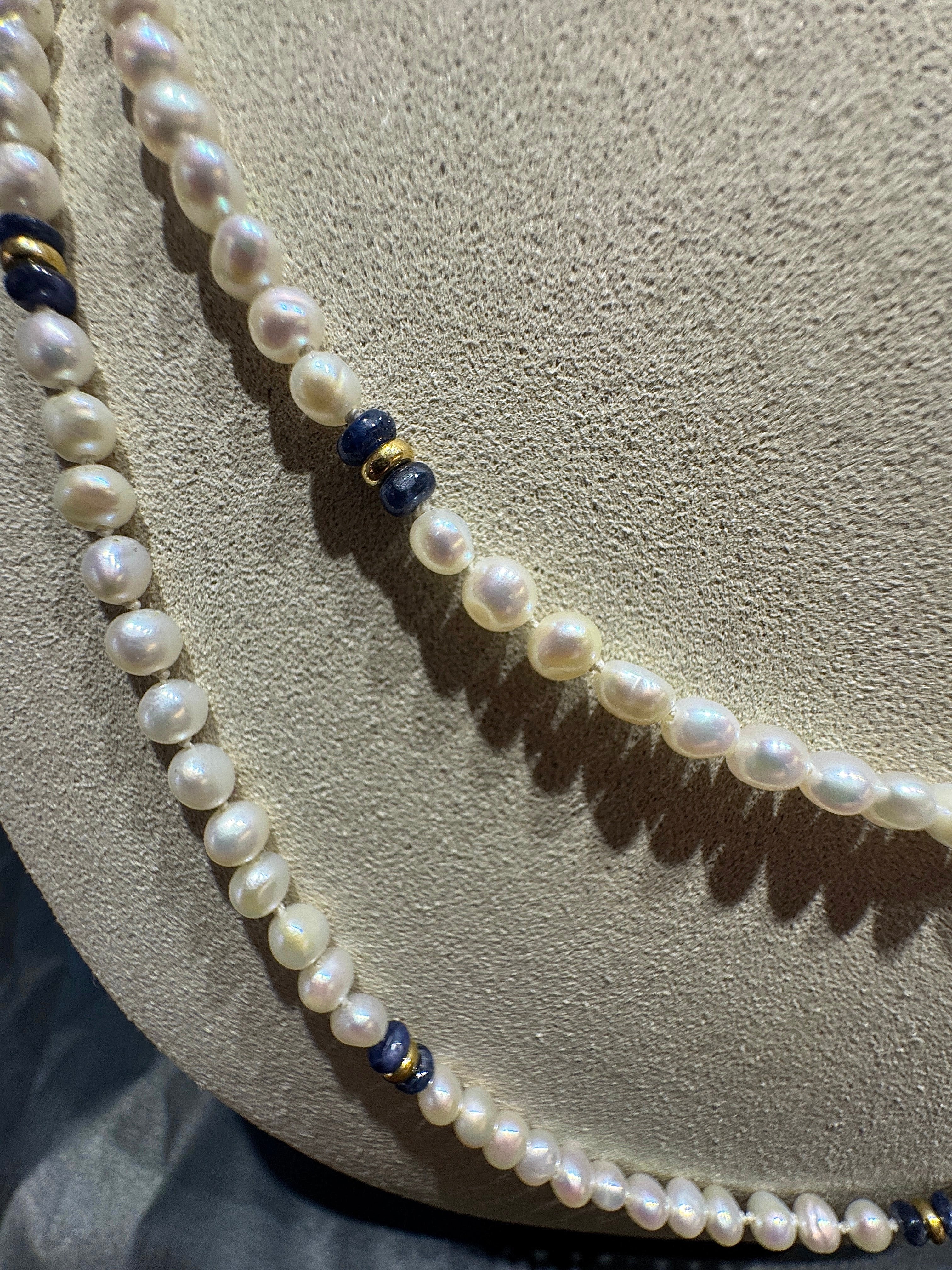 Extravagant pearl necklace with blue sapphires and gold elements