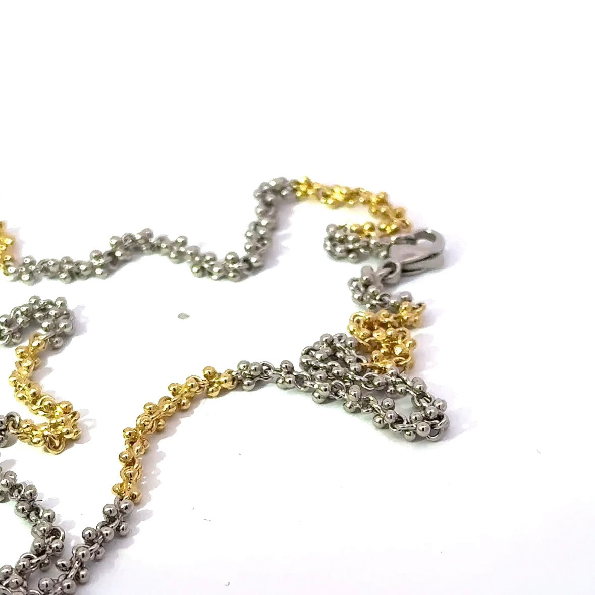 Ausgefallene Halskette in 18 Karat Gelbgold und 950er Platin