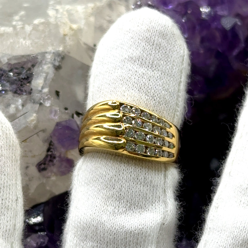 Wide 18 carat yellow gold ring with very fine diamonds in channel settings