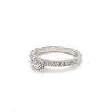 Solitaire ring in 18 carat (750) white gold with 0.5 carat brilliant + small. Diamonds