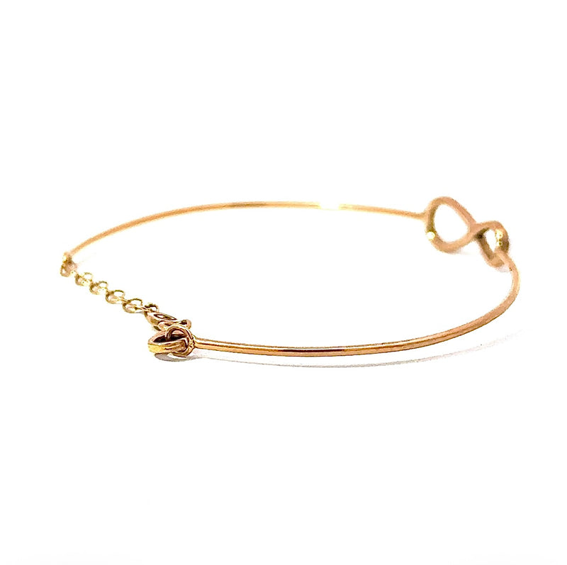 Zierlicher Armreif in 18 Karat warmem Roségold mit Unendlichkeitszeichen