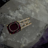 Modern gemstone pendant in 18 carat yellow gold with large rhodolite and fine brilliant-cut diamonds