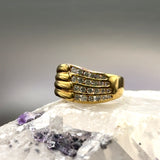 Wide 18 carat yellow gold ring with very fine diamonds in channel settings