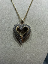 Elegant bicolor heart in 10 carat gold with 67 diamonds