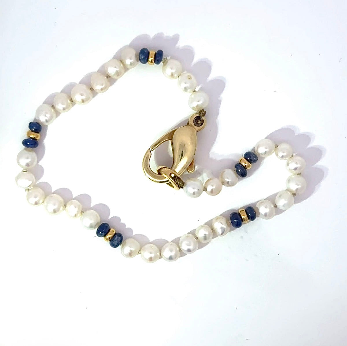 Playful Pearl Bracelet with 14K Yellow Gold and Blue Sapphires