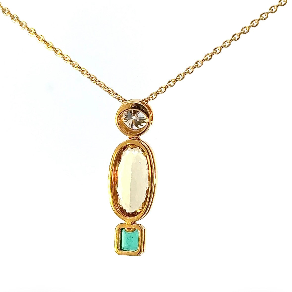 Modern pendant in 18K yellow gold with brilliant-cut diamond, emerald & heliodor