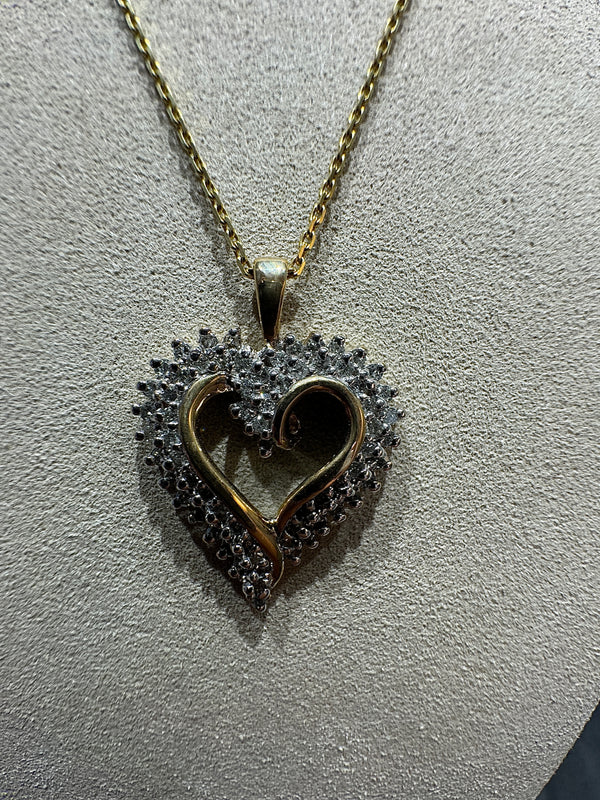 Elegant bicolor heart in 10 carat gold with 67 diamonds