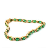 Steinbetontes Armband in 14 Karat Gelbgold mit Smaragden & Brillanten