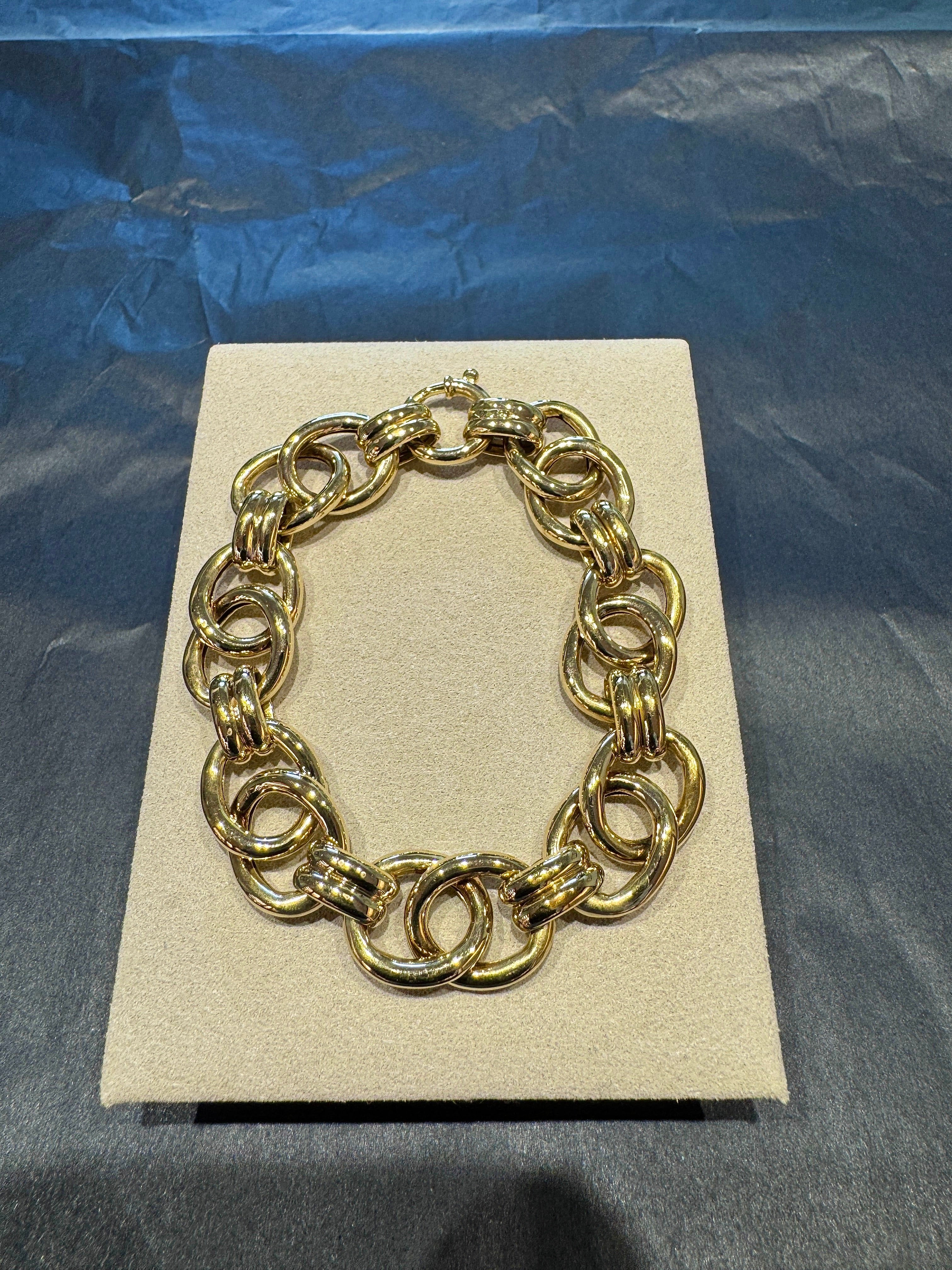 Wide 14 karat yellow gold bracelet with spring ring clasp