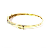 Aufregender Armreif in 14 Karat Gelbgold mit Rubinen und Diamanten
