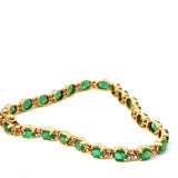 Steinbetontes Armband in 14 Karat Gelbgold mit Smaragden & Brillanten