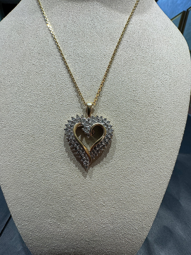 Elegant bicolor heart in 10 carat gold with 67 diamonds