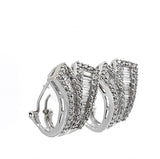 Aufregende Ohrringe in 18 Karat Weißgold mit Brillanten & Diamant-Baguettes