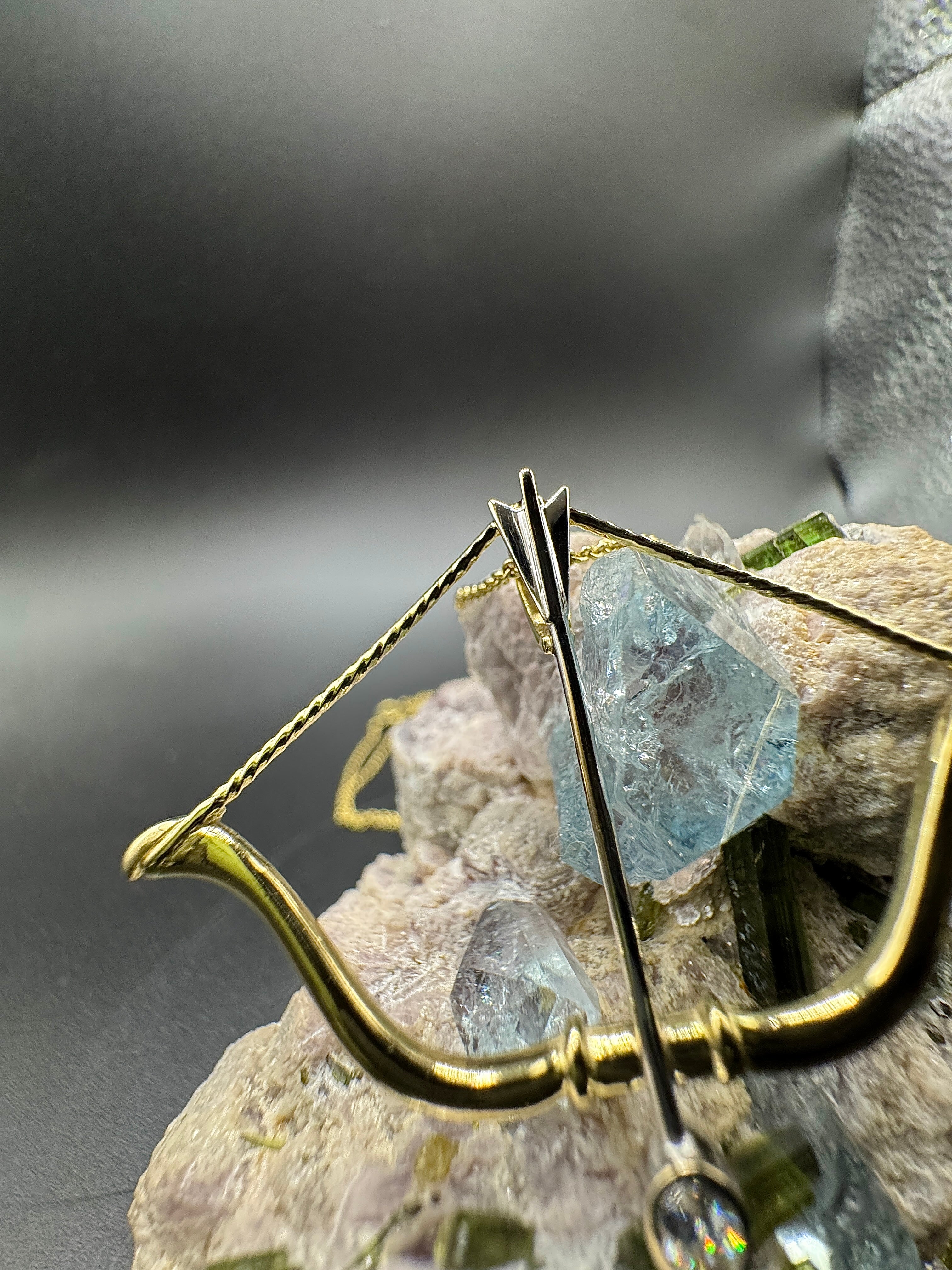 Cupid's bow and arrow in 14 karat yellow gold with exquisite brilliant-cut diamond drops