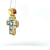 High-quality handmade cross pendant in 18 carat yellow gold with fine topazes