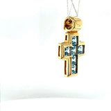 High-quality handmade cross pendant in 18 carat yellow gold with fine topazes