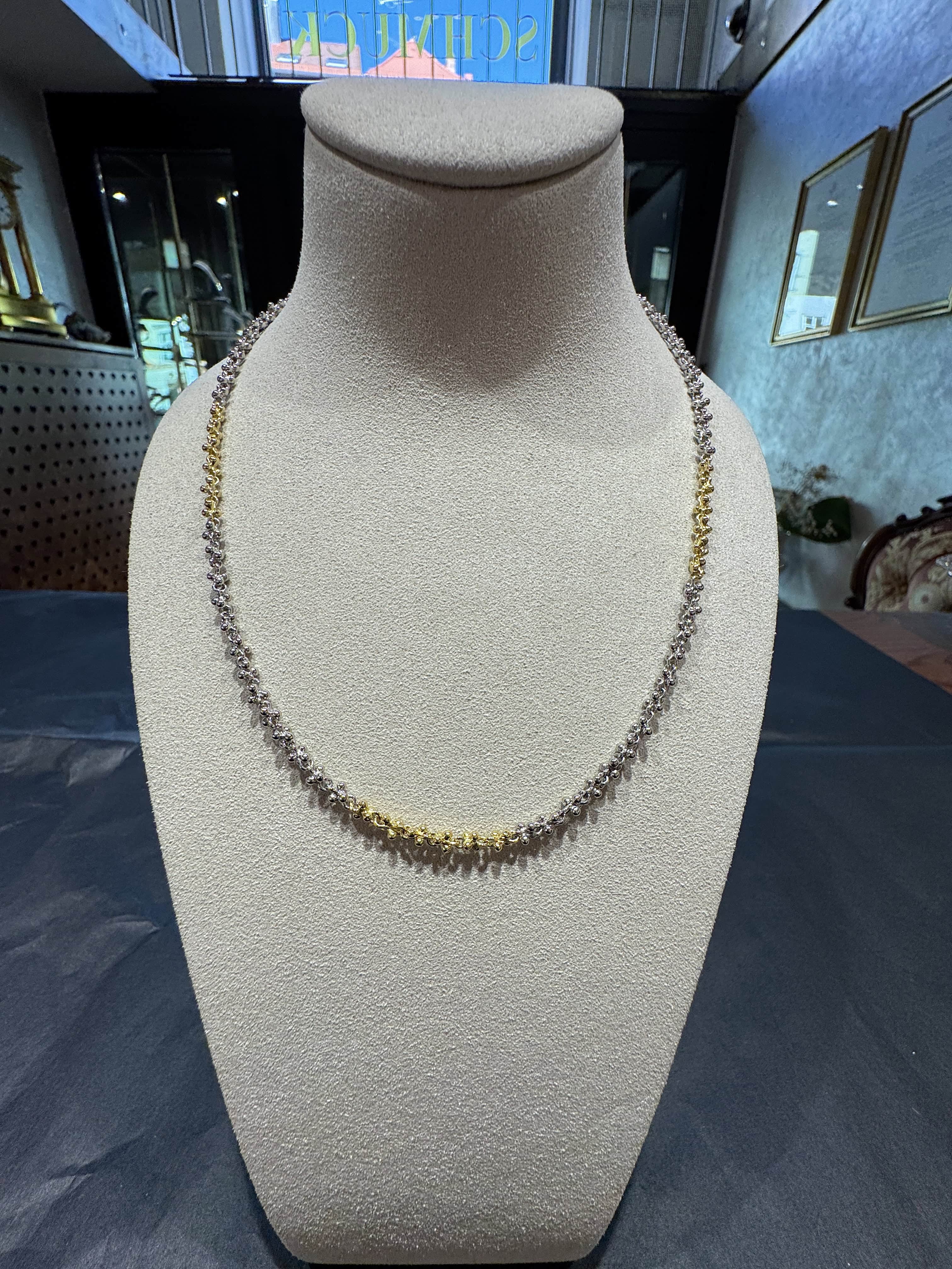Ausgefallene Halskette in 18 Karat Gelbgold und 950er Platin