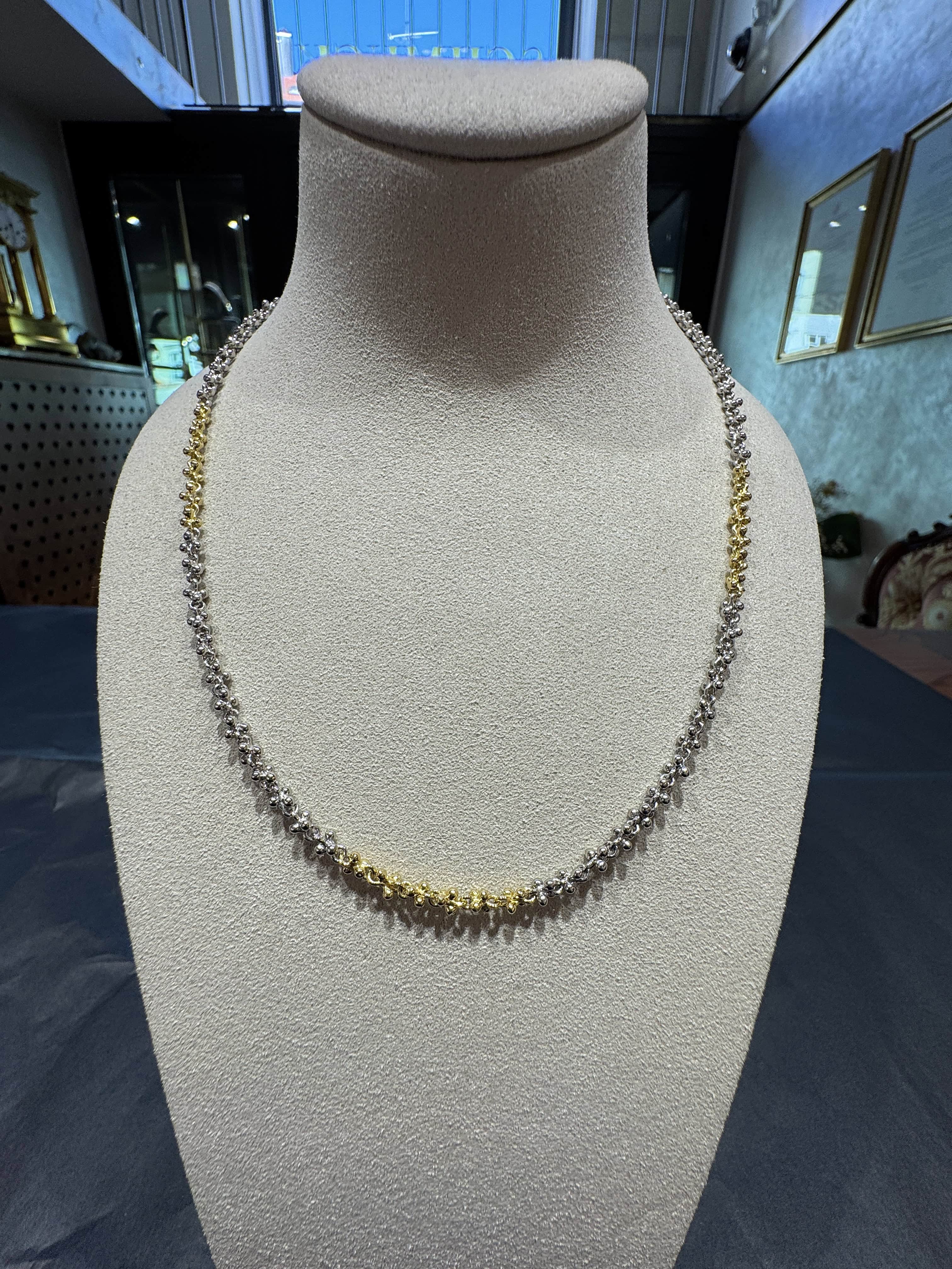 Ausgefallene Halskette in 18 Karat Gelbgold und 950er Platin