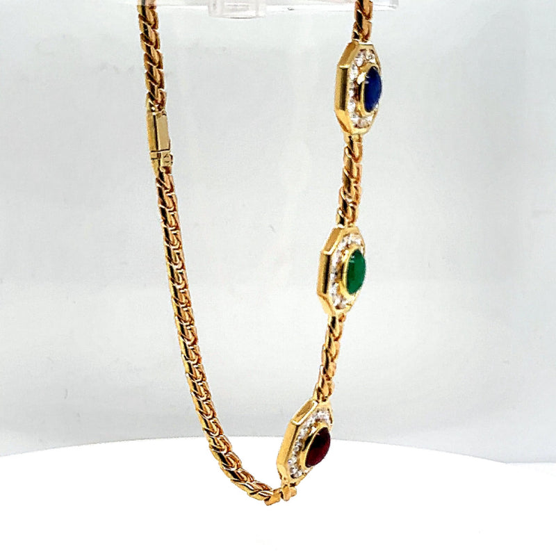 Elegant bracelet in 14 carat yellow gold with gemstones and diamonds 