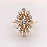 Unusual designer ring in 14 carat yellow gold with lively diamonds