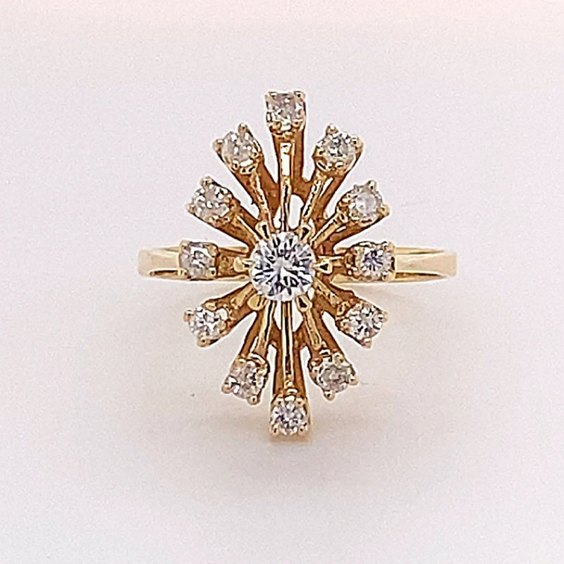 Unusual designer ring in 14 carat yellow gold with lively diamonds