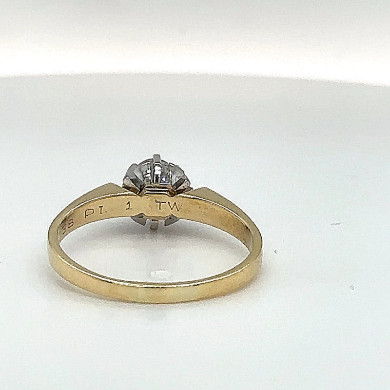 Handmade solitaire ring in 14 carat yellow and white gold with fine diamonds